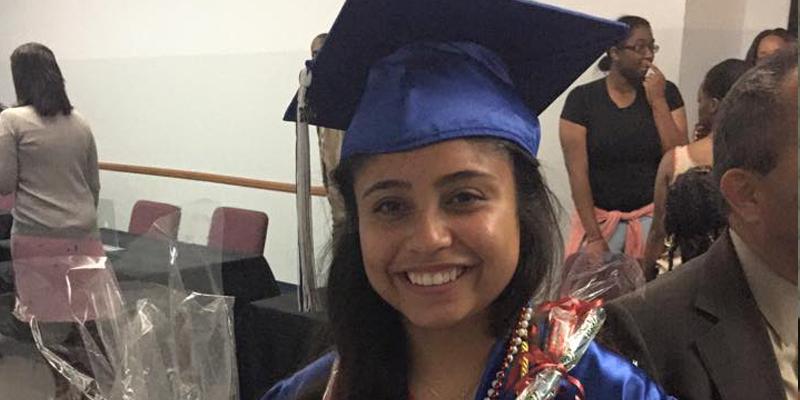 Student with graduation cap and gown