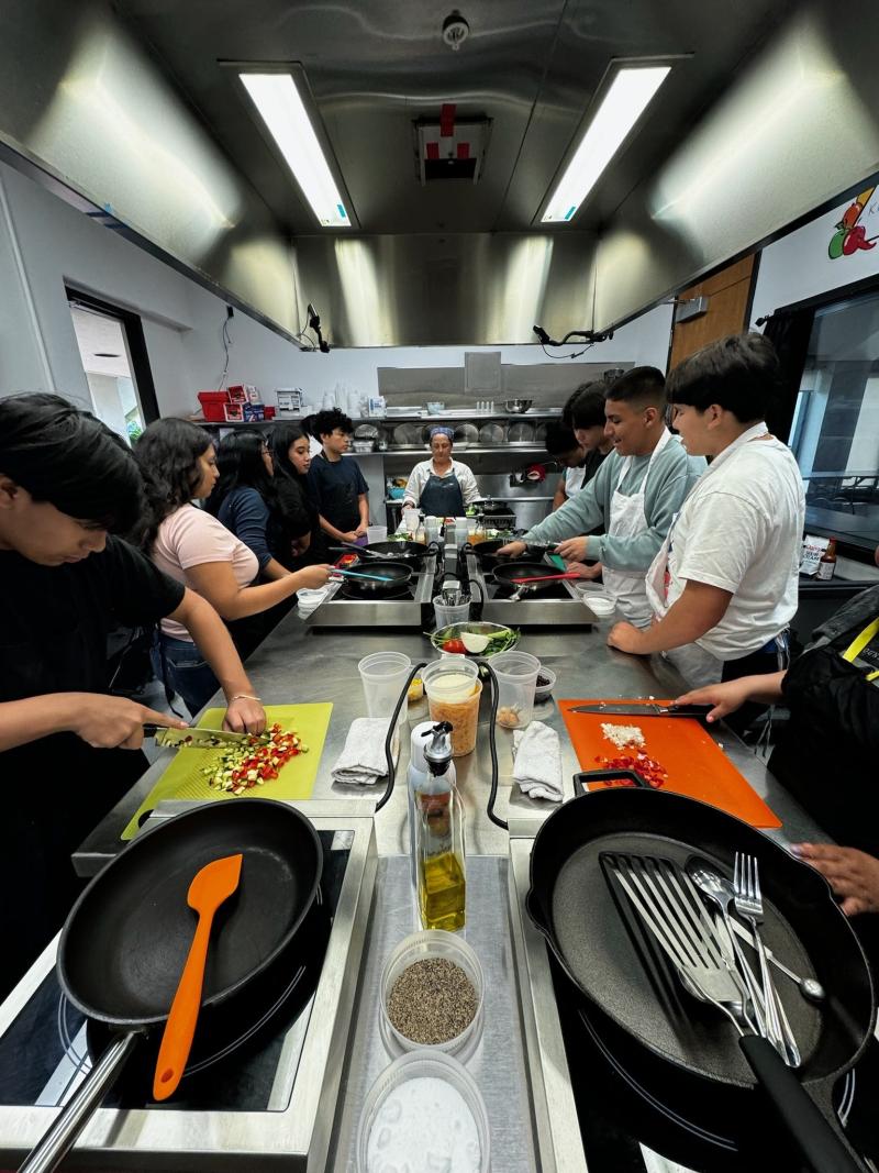 Scholars taking a cooking class 